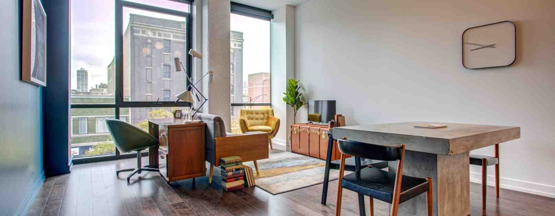 Modern apartment living room with subtle smart home devices - smart home apartment ideas