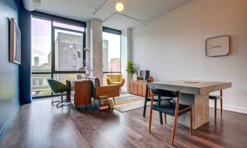 Modern apartment living room with subtle smart home devices - smart home apartment ideas
