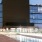 Nighttime rooftop deck atop Uptown Chicago apartment building with ample seating