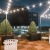 Nighttime rooftop deck with ample seating