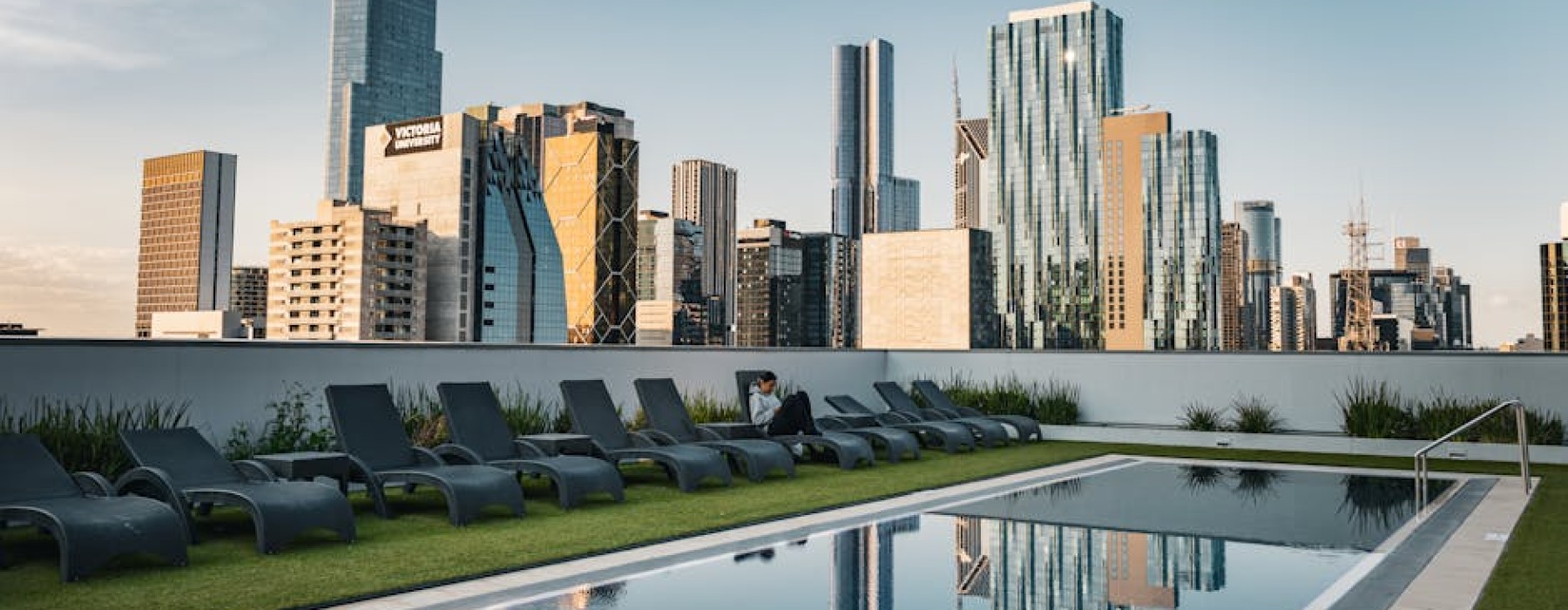 Chicago rooftop pool at sunset - apartments with resort amenities